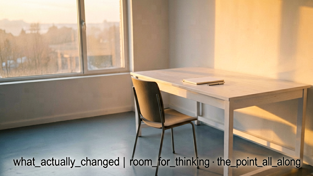 Forensic shot of a contemplative wide-open workspace on a cold floor with a single chair facing a large window showing dawn light